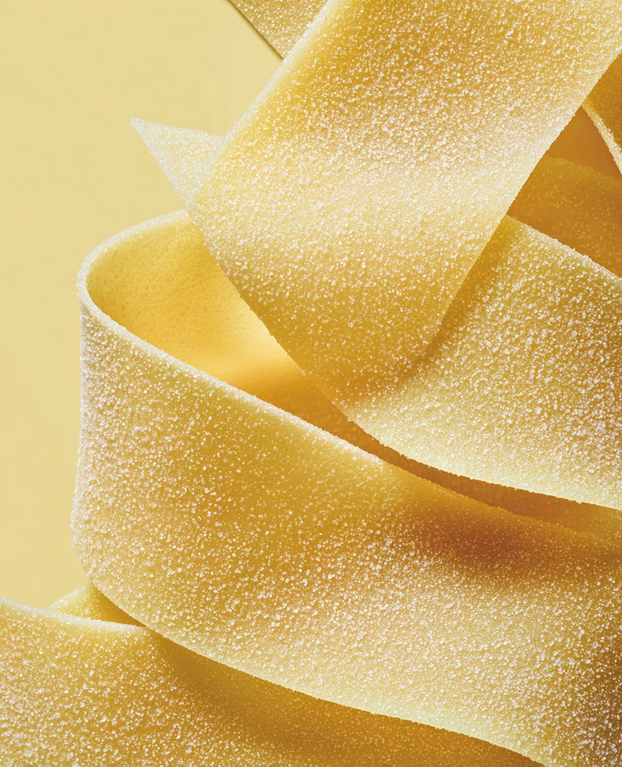 Ribbons of fresh yellow pasta dusted with flour